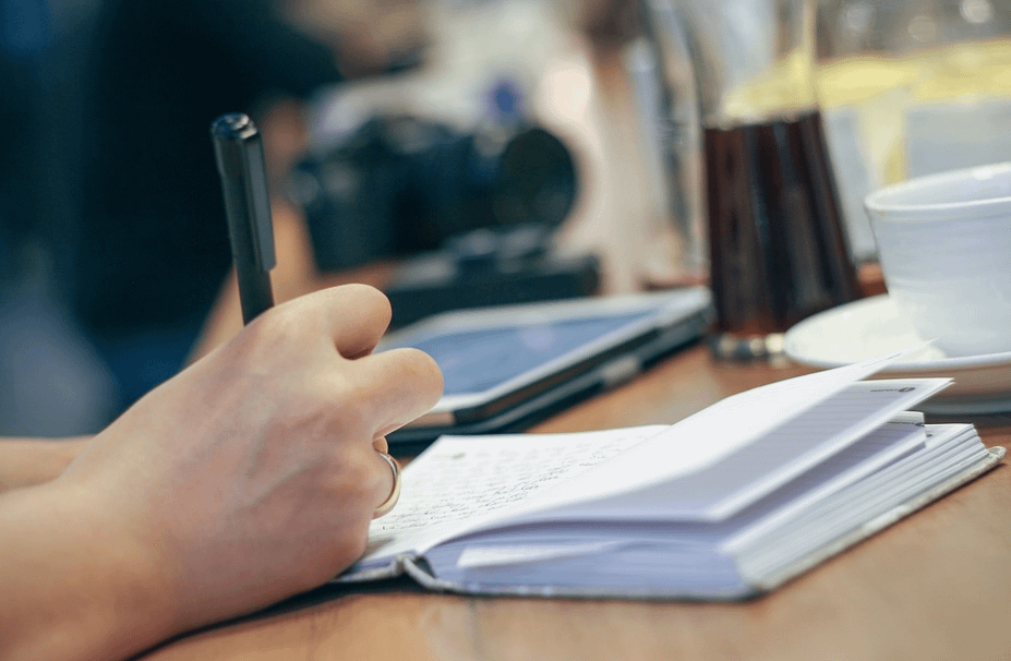 writing in a notebook